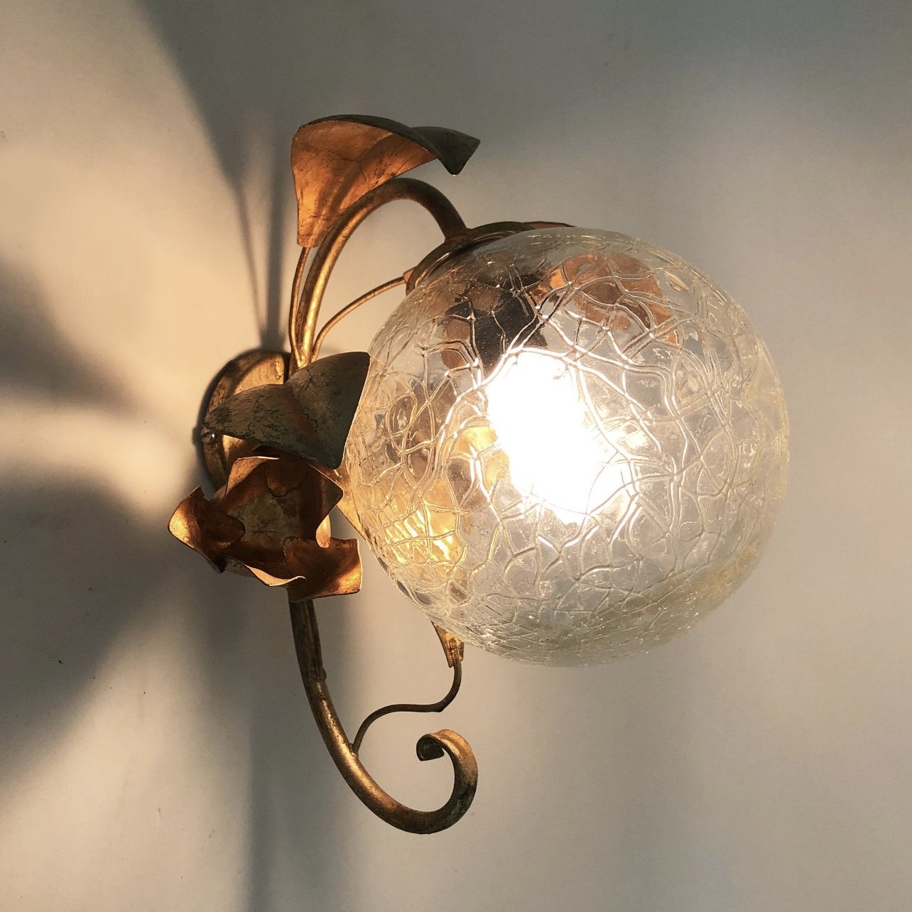 ITALIAN GILT METAL AND GLASS GLOBE SCONCES