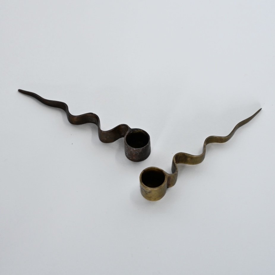 PAIR OF SERPENTINE BRASS CANDLE HOLDERS