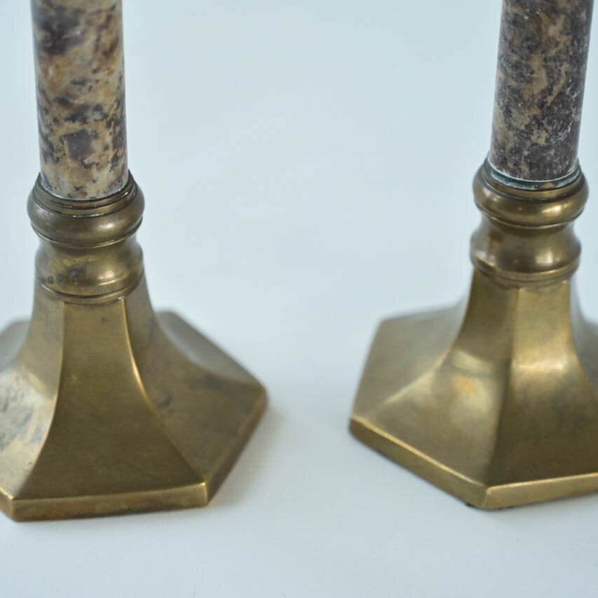 PAIR OF STONE AND BRASS CANDLE HOLDERS