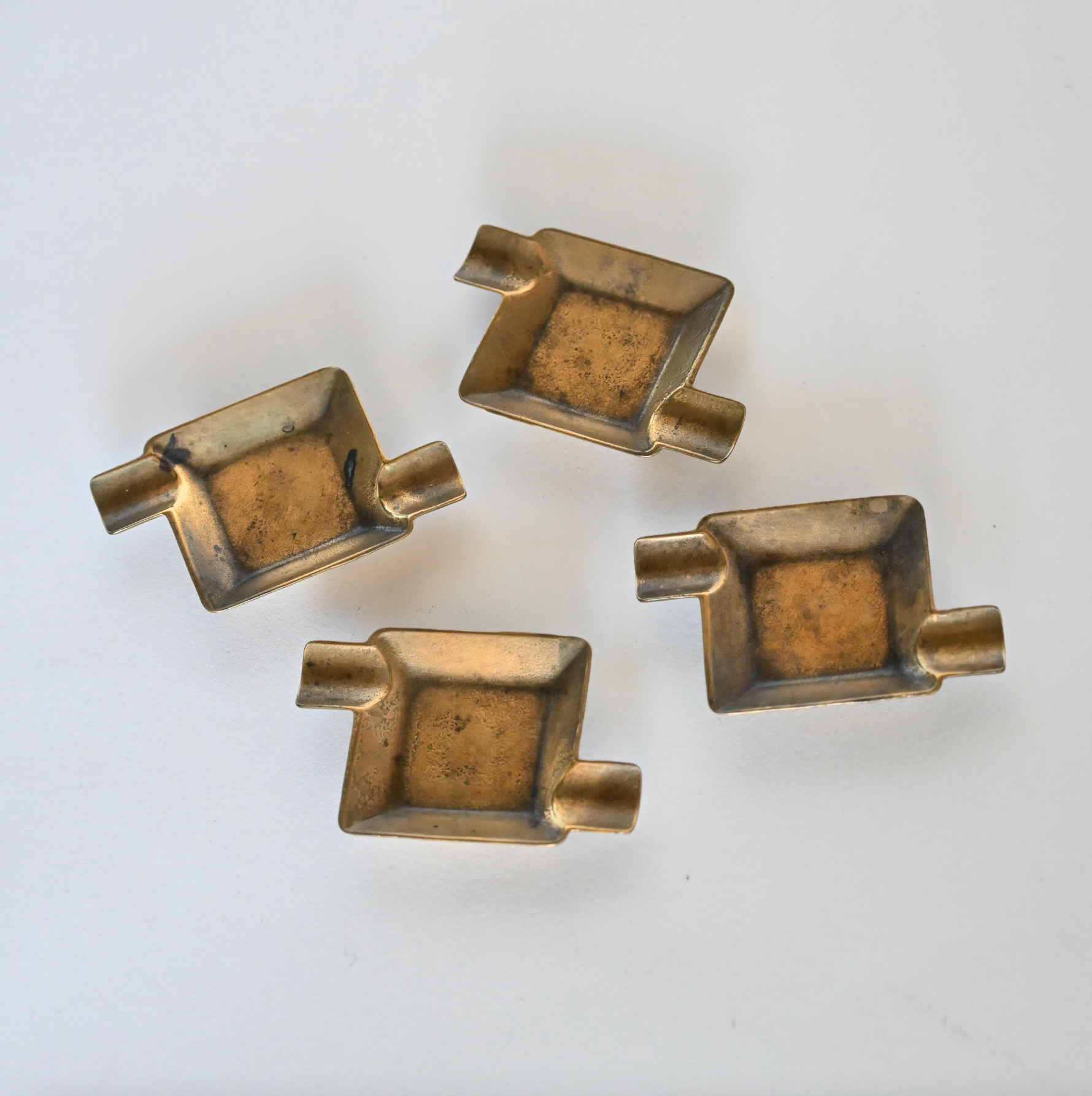 SET OF 4 BRASS ASHTRAYS