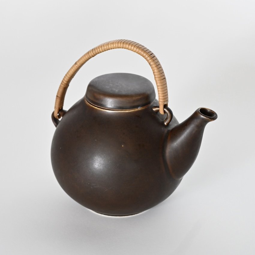 VINTAGE CERAMIC AND RATTAN TEAPOT