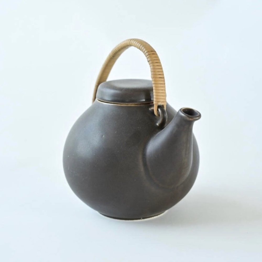 VINTAGE CERAMIC AND RATTAN TEAPOT