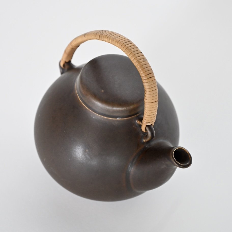 VINTAGE CERAMIC AND RATTAN TEAPOT