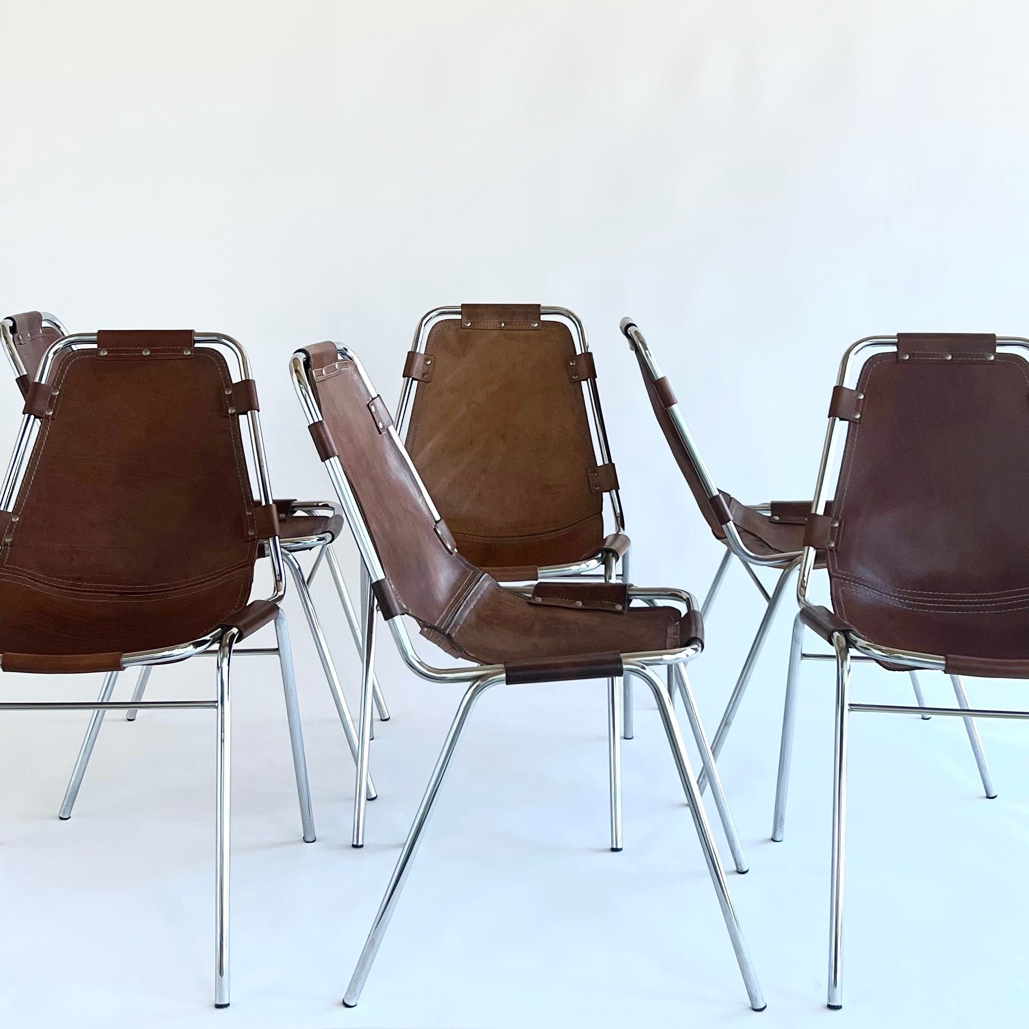 SET OF TEN LES ARC DINING CHAIRS