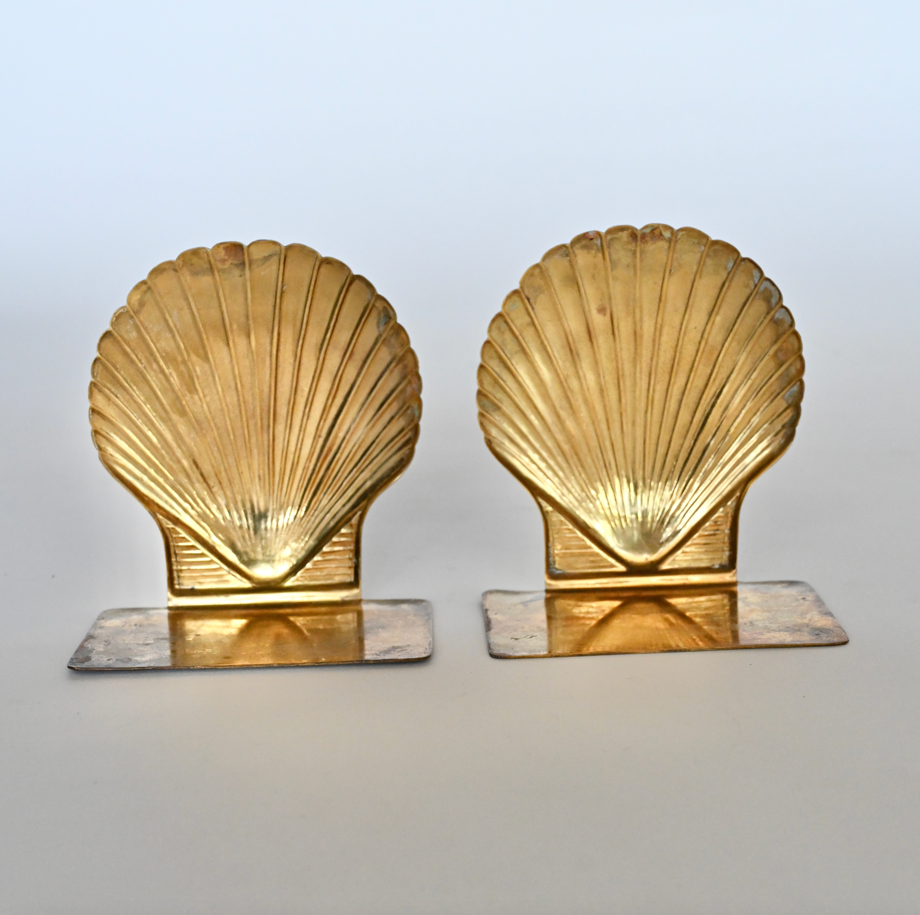 Pair of brass shell bookends